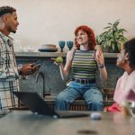 a group of people sitting around a table